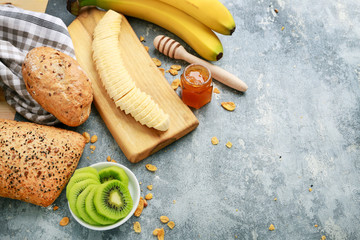 Breakfast time: fruits, buns and honey.