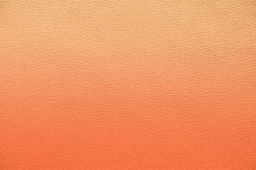 Fototapeta premium Texture of genuine leather. Gentle color leather texture closeup. Colorful background with gradient. Delicate pink color.