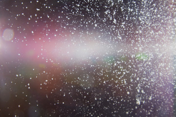 Abstract dust explosion and flash with illumination on a black background