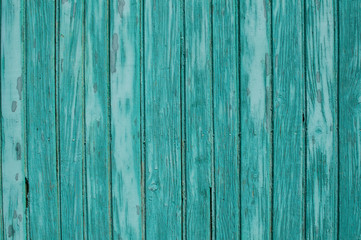 Fototapeta na wymiar Old weathered grunge green painted wooden boards wall closeup as background
