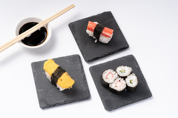 Mix sushi set, Japanese food on slate platte isolated white background