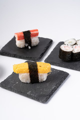 Mix sushi set, Japanese food on slate platte isolated white background