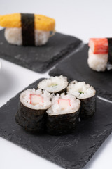 Mix sushi set, Japanese food on slate platte isolated white background