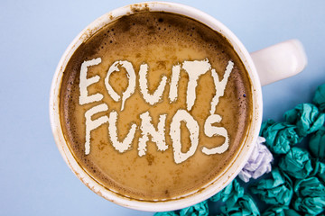 Conceptual hand writing showing Equity Funds. Business photo showcasing Investors enjoys great benefits with long term investment written Coffee in Cup plain background Paper Balls.
