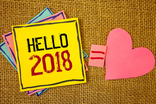 Conceptual hand writing showing Hello 2018. Business photo texts Starting a new year Motivational message 2017 is over nowIdeas created on note papers equal sign heart wicker background