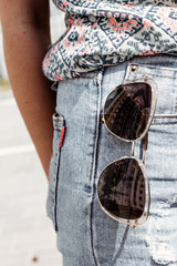 Sunglasses in pocket. Concept vacation, minimalism, city.