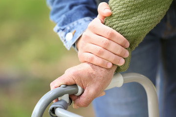 Elderly man with son in park, closeup