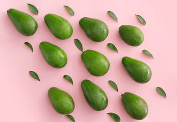 Fresh ripe avocados on color background