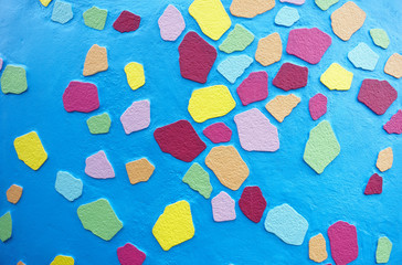 Colorful mosaic color paint art shape on concrete wall pattern abstract background.