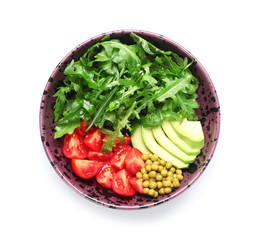 Obraz na płótnie Canvas Bowl with tasty arugula salad on white background