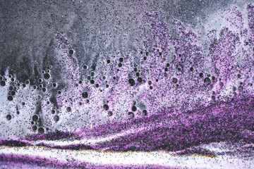 Abstract art background with liquid and colorful sand. Liquid art