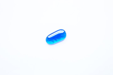 Transparent glass pebble on white background