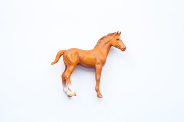 Fototapeta na wymiar Figurine of a horse on white background
