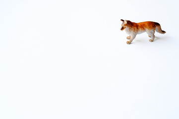 Figurine of a dog on white background