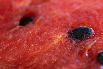 Slices of juicy watermelon shot close-up on a dark background