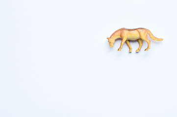 Figurine of a horse on white background