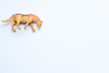 Figurine of a horse on white background
