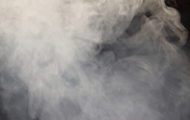 Blurry white mist or smoke or steam on black background, Pollution and burning