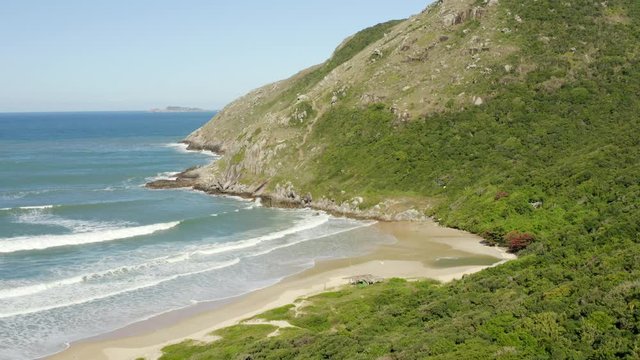 Aerial approach of Lagoinha Do Leste beach and Morro Da Coroa, Florianopolis, Santa Catarina, Brasil