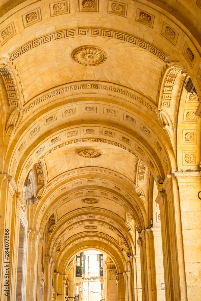 Canvas Prints street with traditional balconies and old buildings in historical city valletta malta