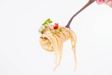 Spaghetti with cream sauce with smoked mackerel, peas ,bell pepper and some parsley eaten with a...