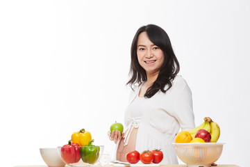 Fototapeta premium Belly women prepare food on the table.