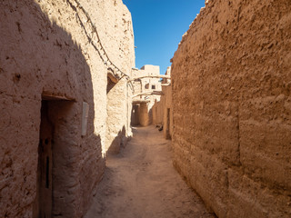 Desert town of Mhamid, Morocco village with nature sand dunes and old muslim mosque in north Africa, old narrow streets, traditional clay mud architecture