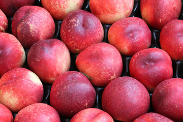 background of organic ripe peaches for sale