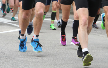 athletes participate in a road marathon