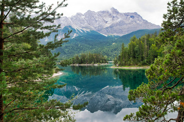 Eibsee lake in front of Zugspitze mountain in Bavaria Germany. Alpine landscape with German Alps mountain Zugspitze 