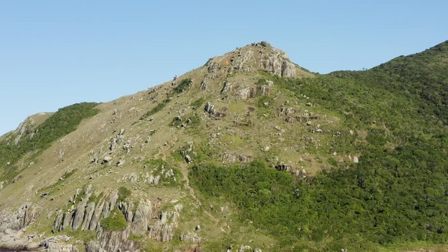 Morro Da Coroa establishing aerial cinematic shot at Lagoinha Do Leste beach, Florianopolis, Santa Catarina, Brazil