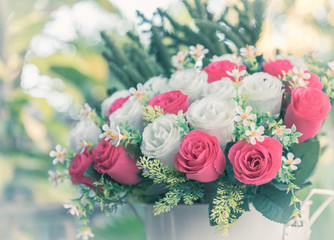 Bouquet of red and white roses in pastel vintage color style.