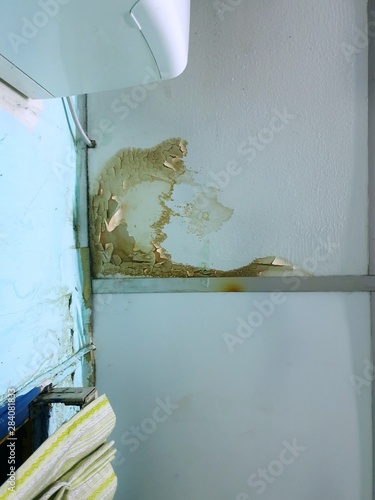 Water Leak On The Ceiling Tiles From The Damaged Roof In
