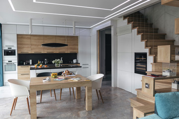 Modern kitchen with stairs to the second floor stock photo