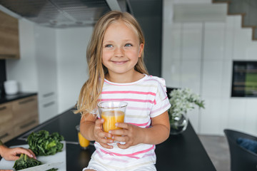 Girl enjoying favorite orange juice stock photo