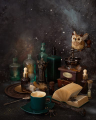 Magic coffee on the table. Spiders, potions and a magic wand for the mage.