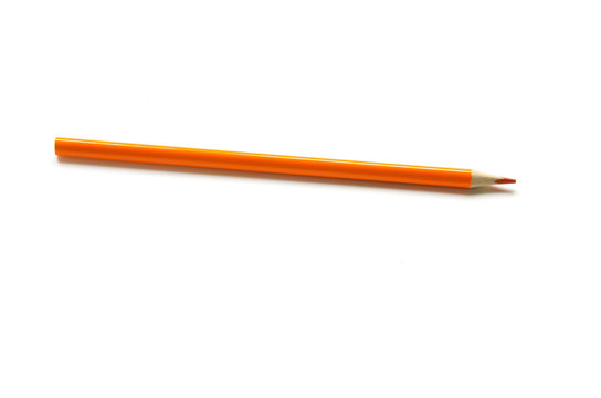 Orange color pencil on white background. - Image