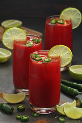 Jalapeno tomato margarita cocktail with lime