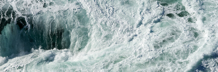 Panoramic water surface texture. Sea water splash with foamy wave