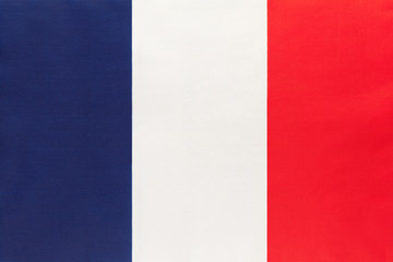 France national fabric flag, textile background. Symbol of international world european country.