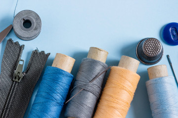 Sewing kit on a light blue background.