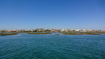 Naklejka premium Faro city and natural park Ria Formosa in the south of Portugal