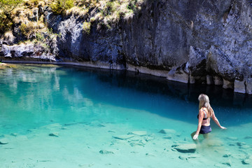 Woman enjoying the cool blue waters of the limestone caves