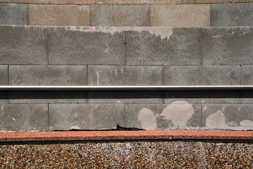 wall of old brick blocks with a metal pipe