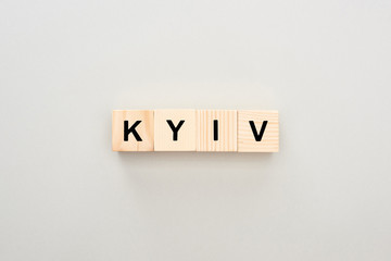 top view of wooden blocks with Kyiv lettering on grey background