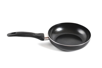 black fry pan over white background