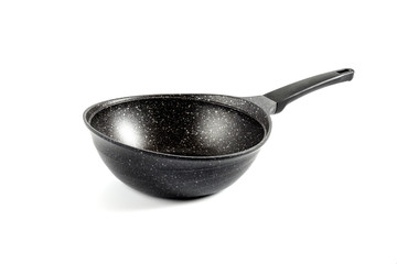 black fry pan over white background