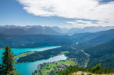 Fototapeta na wymiar Walchensee view The Alps background in Germany land in the region of Garmisch-Partenkirchen emerald water