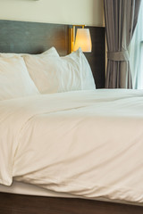 Fototapeta na wymiar Beautiful luxury comfortable white pillow and blanket on bed