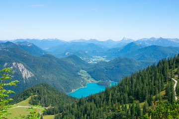 Fototapeta na wymiar Walchensee view The Alps background in Germany land in the region of Garmisch-Partenkirchen emerald water